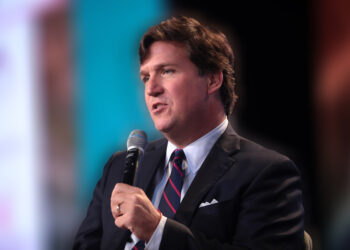 Is Tucker Carlson guilty of treason for questioning the Biden-pushed narrative?